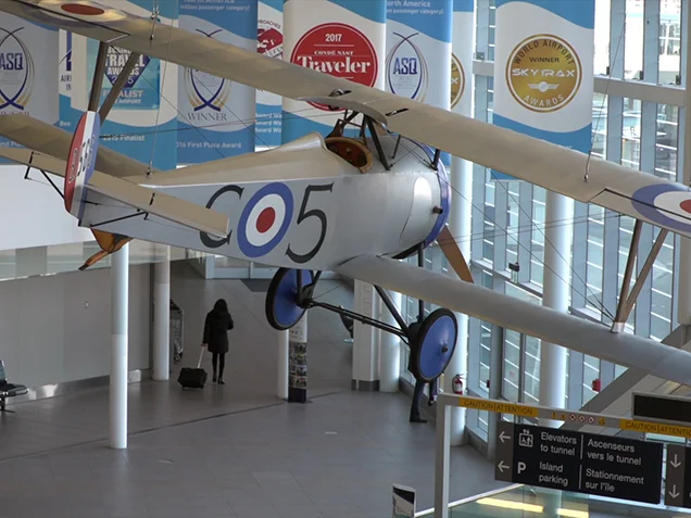 World War 1 plane hanging in the Corbit Barot Airpot atrium